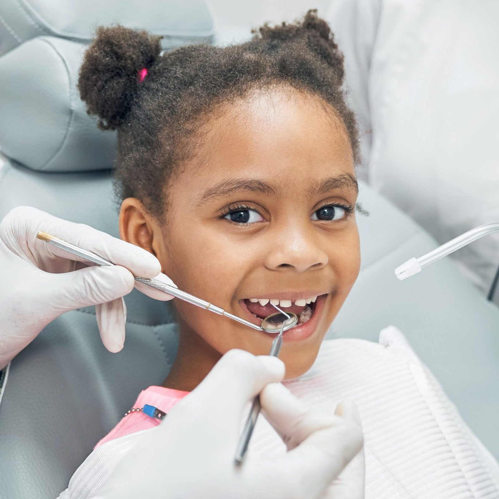 happy afro kid regular check up teeth dental clinic scaled e1711596987635